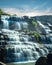 Tropical rain forest landscape with flowing blue water of Pongour waterfall. Vietnam