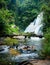 Tropical rain forest landscape with Pha Dok Xu waterfall and bamboo bridge. Thailand