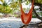 Tropical resort with chaise longs and hammocks