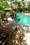 Tropical resort landscaping, pool side chairs