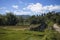 Tropical rural landscape with simple rustic hut. Mountain landscape with terrace rice fields.