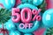 Tropical Sale Theme with Blue Balloon Letters Spelling Fifty Percent Off