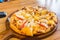 Tropical Seafood Pizza on wooden background