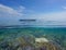 Tropical seascape outrigger canoe and coral reef Pacific ocean