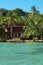 Tropical seaside house with dock and lounger