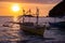 Tropical sunset landscape with traditional filipino boat. Idyllic seaview on tropical island. Yellow sunset sky template