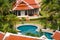 Tropical swimming pool and palm trees in luxury property