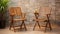 Tropical Symbolism: Wooden Folding Chairs On White Table And Brick Wall