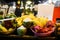 Tropical thai fruits stall at local food market in Thailand. Coconut, dragonfruit, banana and mango at night fair.