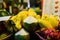 Tropical thai fruits stall at local food market in Thailand. Coconut, dragonfruit, banana and mango at night fair.