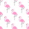 Tropical trendy seamless pattern with pink decorative flamingos from palm leaves on white background.