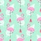 Tropical trendy seamless pattern with pink flamingos, watermelon and palm leaves on mint green background.