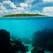 Tropical underwater shot splitted with island