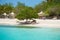 Tropical vacation blue sky and lounge chairs on white sand beach