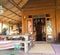 Tropical veranda and entrance to rustic wooden home.