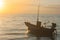 Tropical view of sea and fishing boats with sunset light at Chao Lao Beach.