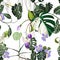 Tropical violet flowers and tropical leaves, light background. Seamless pattern. Jungle foliage illustration. Exotic plants.