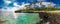 Tropical volcanic beach on Samoa Island with many palm trees