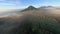 Tropical volcano island mountain fog landscape early morning environment aerial panorama view