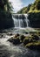 A tropical waterfall cascades with the untamed beauty of water.