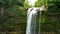 A tropical waterfall in a mountain canyon.