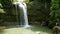 A tropical waterfall in a mountain canyon.