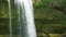 A tropical waterfall in a mountain canyon.