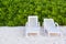 Tropical white sand beach with beach chairs