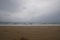 tropical white sand sea beach landscape with rainy rainning cloudscape moving in thunderstrom daytime.Nature beach environment