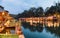 Tropical wooden raft resort illumination on river kwai at dawn