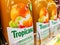 Tropicana squeezed clementine juice bottles on shelves in a french supermarket