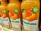 Tropicana squeezed clementine juice bottles on shelves in a french supermarket