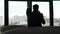 Troubled businessman in silhouette talking on the phone