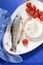 Trout baked with onion sauce and cherry tomatoes