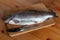 Trout lying on a cutting board in the kitchen