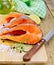 Trout with oil and knife on board