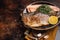 Trout roasted fillet, grilled fish on a plate with thyme and lemon. Dark background. Top view. Free space for your text