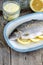 Trout stuffed with lemon slices and seasoned with aroma sea salt with lemon peel