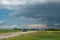 Truck approaching with looming storm clouds, Saskatchewan, Canad