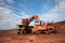 Truck is being loaded with ore at a mine site