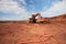 Truck is being loaded with ore at a mine site