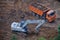 Truck and bulldozer are being built near the green tree, top view - July 10, 2020, Moscow, Russia