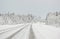 Truck and a car in a snow covered road in Finland on the Arctic