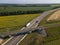 Truck with Cargo Semi Trailer Moving on Road in Direction. Highway intersection junction. Aerial Top View