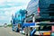 Truck carrier with mini vans on the asphalt road Slovenia