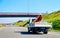 Truck carrying trailer with crane road Slovenia