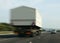 TRUCK CARRYING WIDE LOAD ON MOTORWAY