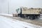 Truck cleaning  winter road covered with snow