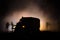 Truck in the conflict zone. The war in the countryside. War vehicle silhouette at night. Battle scene.