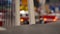 Truck crossing the bridge, close up, fire truck in the background - unfocused style of the camera